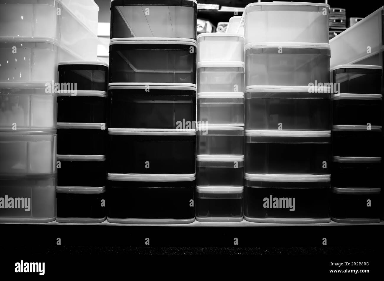 Rows of stacked plastic containers for organization and storage. Stock Photo