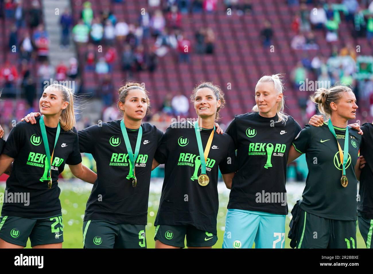 Cologne, Germany. 18th May, 2023. Players of Wolfsburg (Jule Brand, Lena Oberdorf, Dominique Janssen, Katarzyna Kiedrzynek and Alexandra Popp) celebrate their victory of the Final during the DFB Pokal Final football match between VFL Wolfsburg and SC Freiburg at RheinEnergieSTADION in Cologne, Germany. (Daniela Porcelli/SPP) Credit: SPP Sport Press Photo. /Alamy Live News Stock Photo