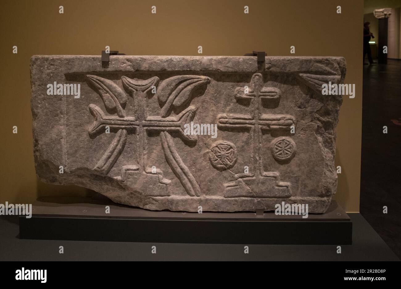 A slab of a pseudo-sarcophagus with crosse on a a stepped base, a ...