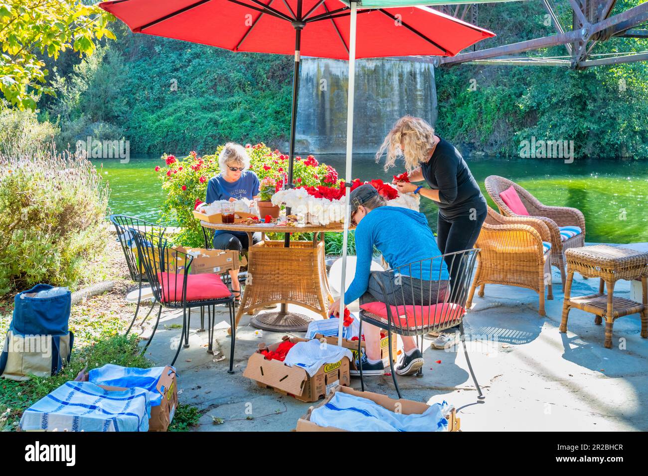 People prepare flower ornaments during the Capitola Begonia Festival in