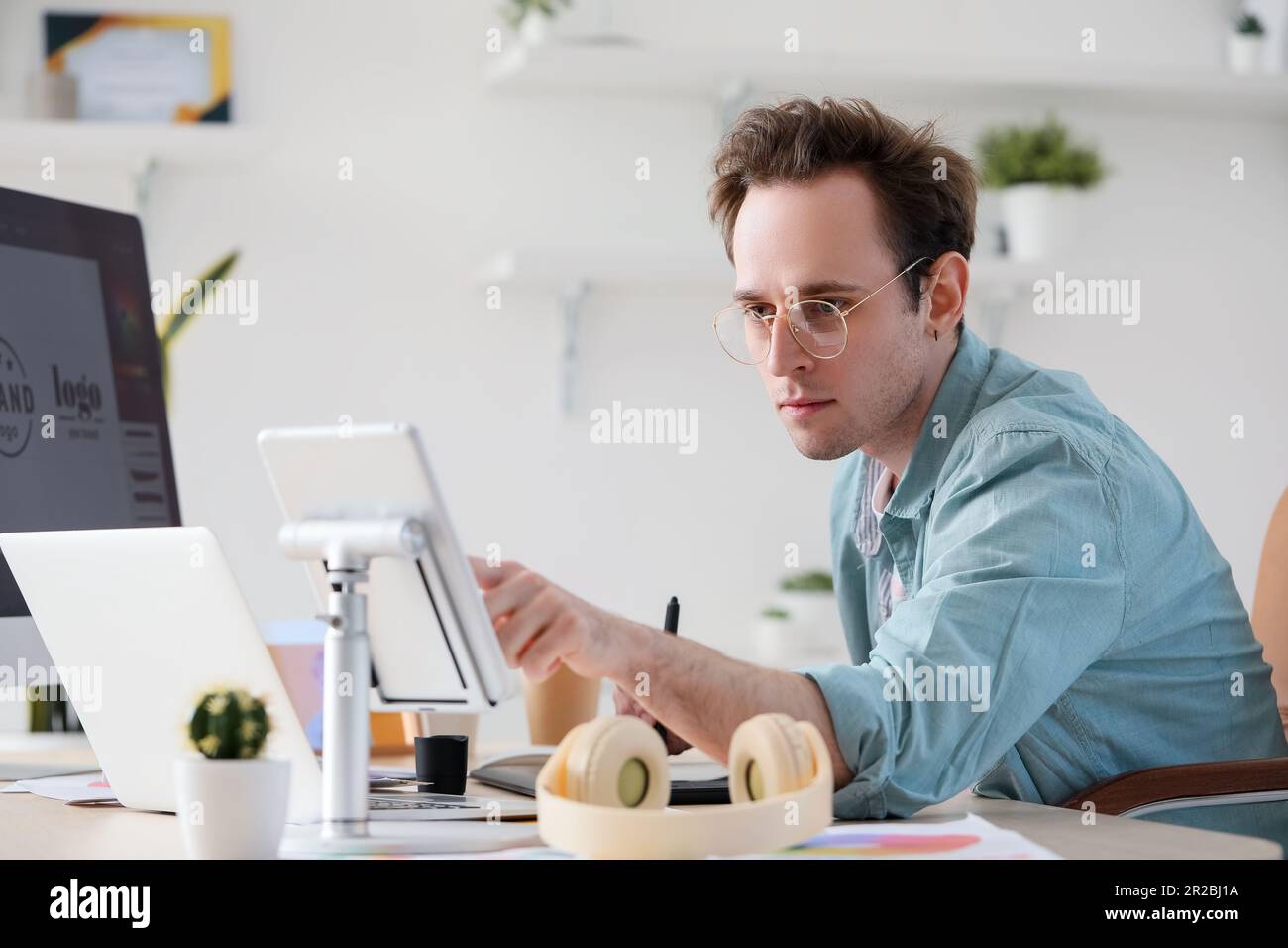 Male graphic designer developing logotype in office Stock Photo