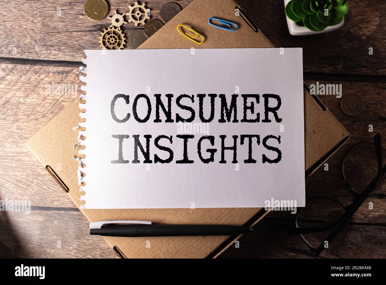 The text Consumer insights on paper notepad and calculator Stock Photo ...