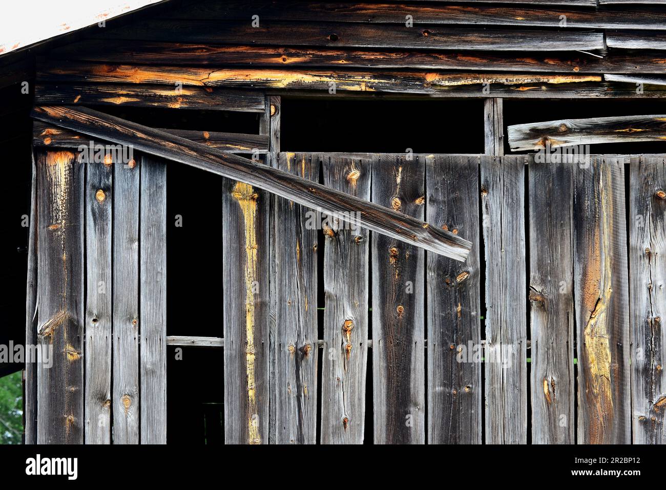 Warped boards on an old barn Stock Photo