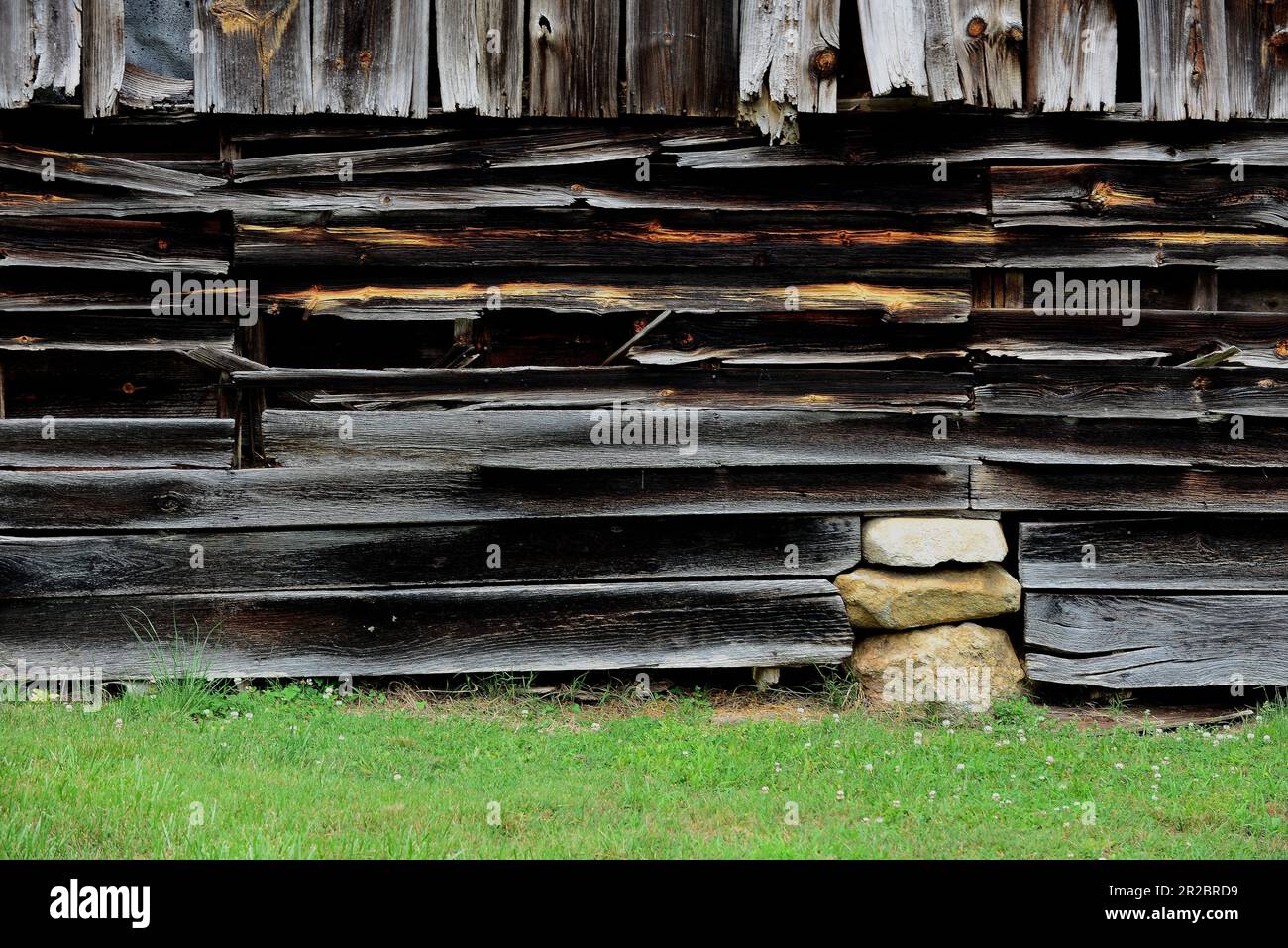 Warped boards on an old barn Stock Photo