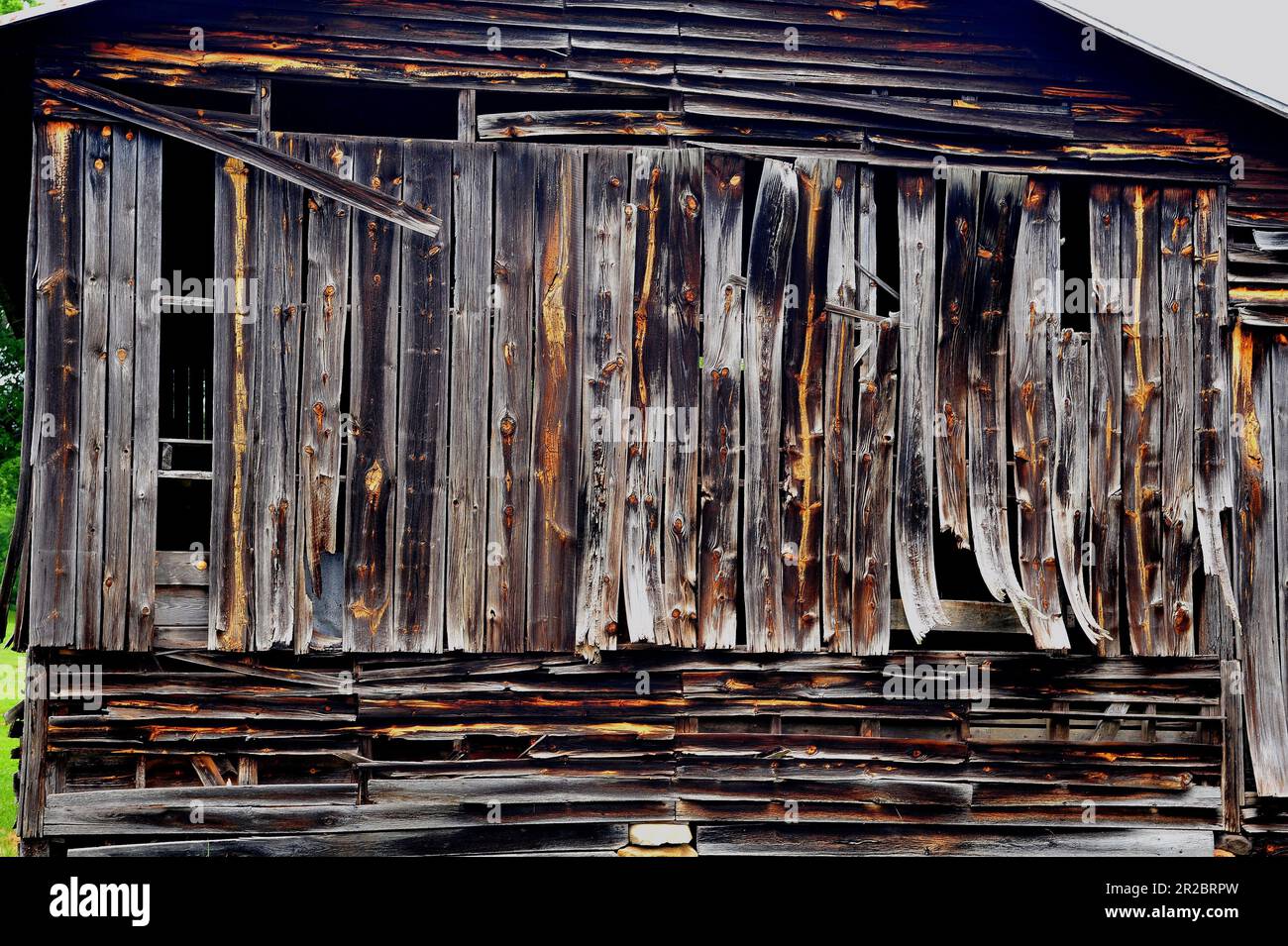 Warped boards on an old barn Stock Photo