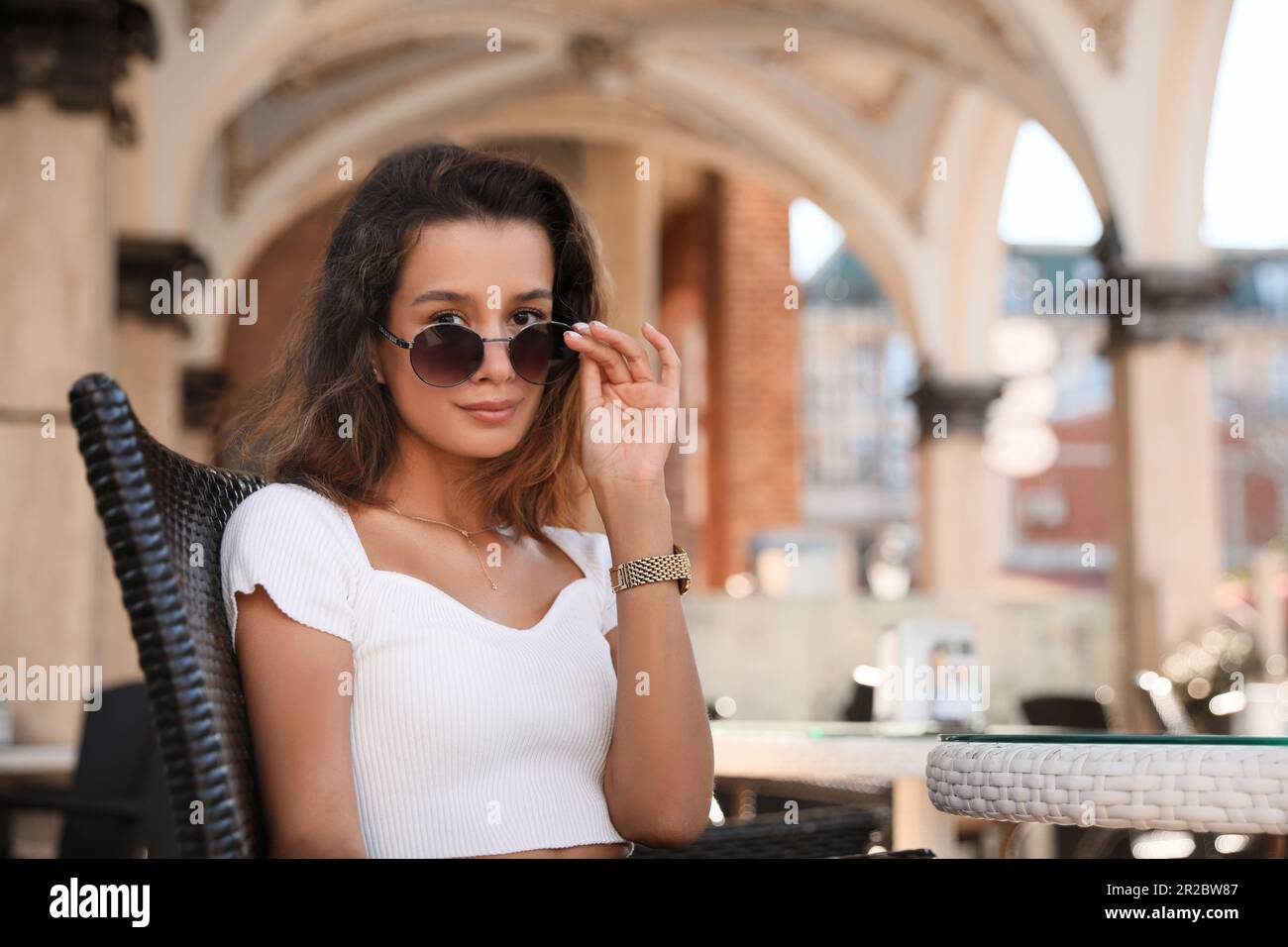 Portrait of beautiful young woman in outdoor cafe Stock Photo - Alamy