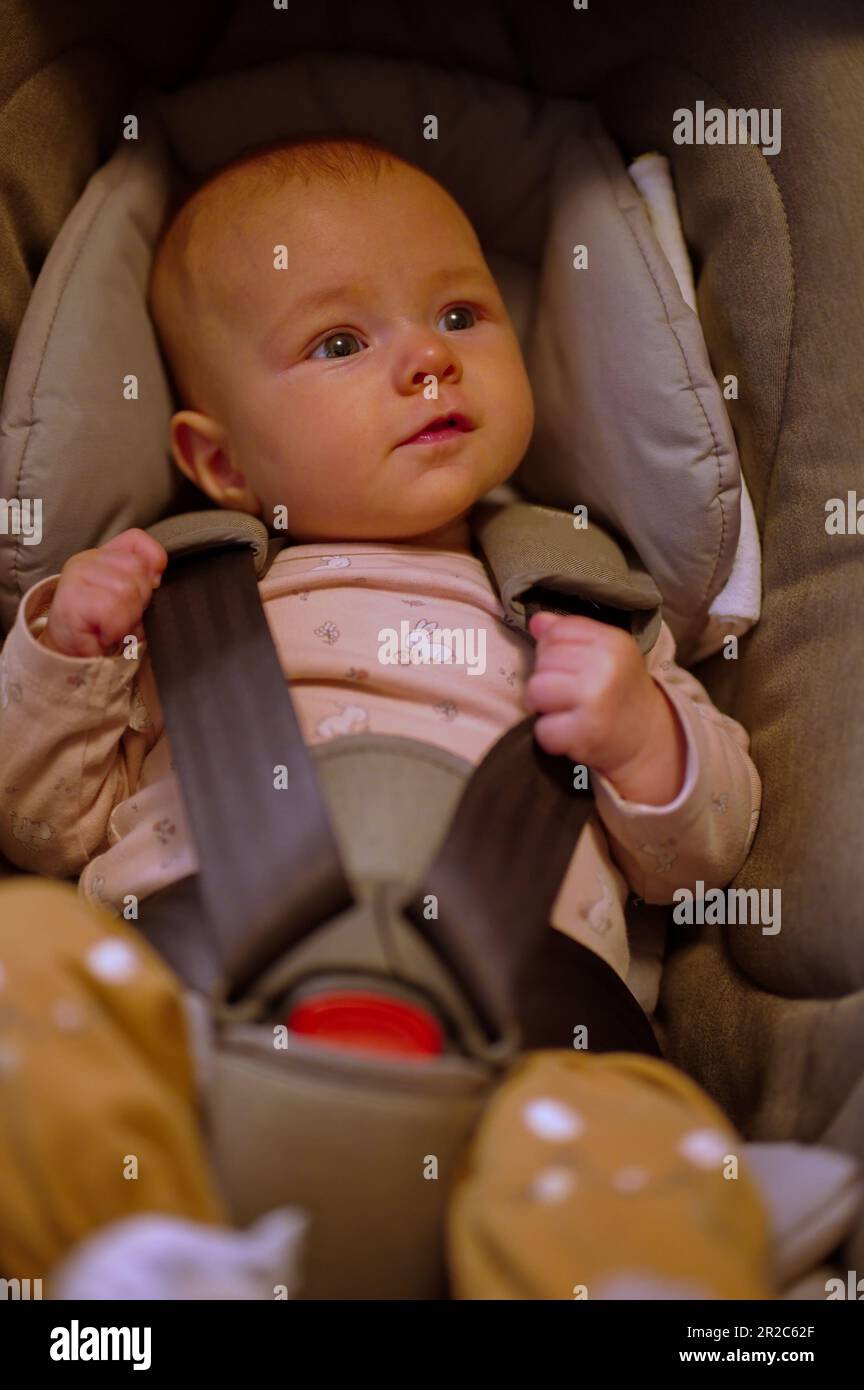 Portrait of little baby girl in baby stroller Stock Photo