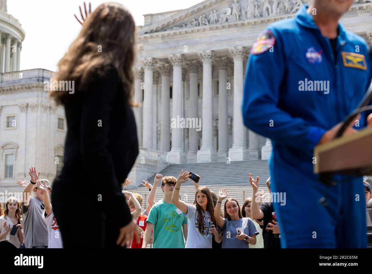 President of the Canadian Space Agency Lisa Campbell waves to children passing by during a news conference about NASA's Artemis II mission outside the Capitol in Washington, DC, Thursday, May 18, 2023. Credit: Julia Nikhinson/CNP /MediaPunch Stock Photo