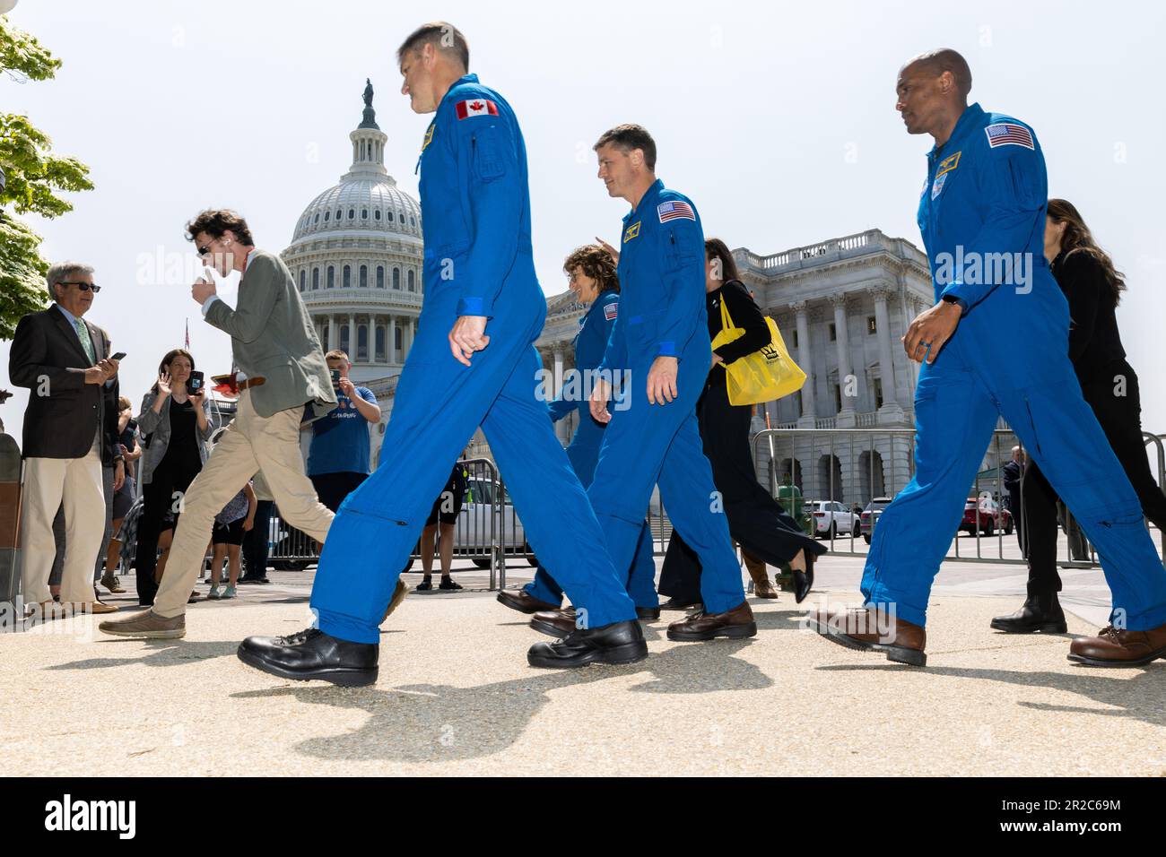 The crew of the Artemis II mission around the moon, NASA astronauts Reid Wiseman, Victor Glover, Christina Hammock Koch and Canadian Space Agency astronaut Jeremy Hansen, walk to a news conference about the mission outside the Capitol in Washington, DC, Thursday, May 18, 2023. Credit: Julia Nikhinson/CNP /MediaPunch Stock Photo
