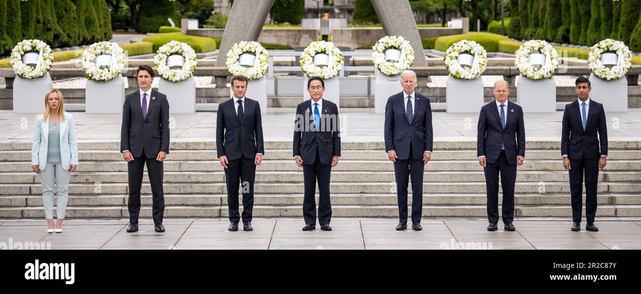 Hiroshima, Japan. 19th May, 2023. Giorgia Meloni (l-r), Prime Minister of Italy, Justin Trudeau, Prime Minister of Canada, Emmanuel Macron, President of France, Fumio Kishida, Prime Minister of Japan, Joe Biden, President of the United States, German Chancellor Olaf Scholz (SPD) and Rishi Sunak, Prime Minister of the United Kingdom, stand next to each other for the group photo in the Peace Park at the G7 Summit. The heads of government of the G7 countries meet in Hiroshima, Japan, for their annual consultations. Credit: Michael Kappeler/dpa/Alamy Live News Stock Photo