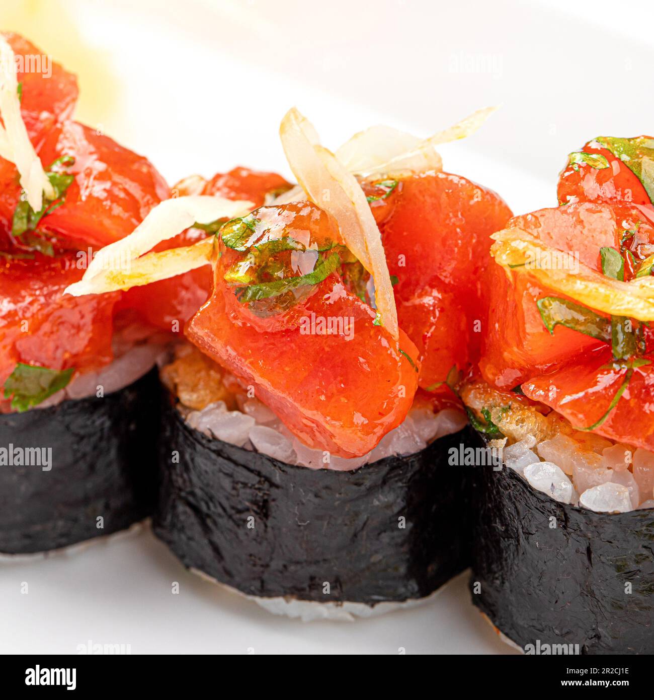 Portion of japanese sushi rolls with spicy tuna fish Stock Photo - Alamy