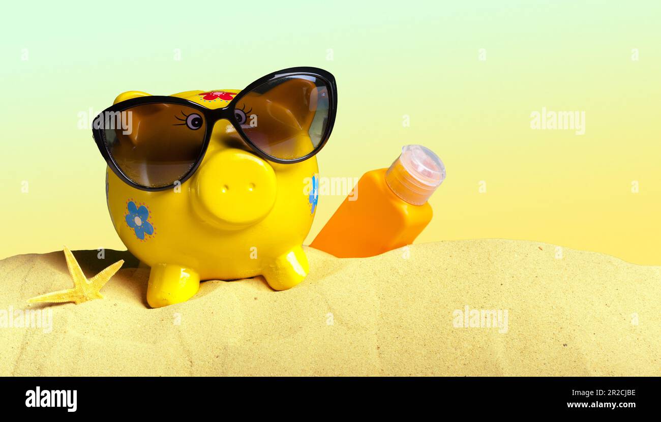 Summer piggy bank with sunglasses on the beach Stock Photo - Alamy