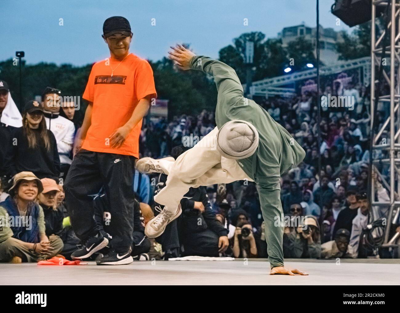 Montpellier, France. 18th May, 2023. Canada's Philip Kim (B-Boy Phil Wizard, right) performs as Japan's Shigeyuki Nakarai (B-Boy Shigekix) looks on during the final of the Adult Breaking 1vs1 B-Boys event at the third stop of World Dance Sport Federation (WDSF) Breaking for Gold (BFG) World Series in Montpellier, France, on May 18, 2023. Credit: Xiao Yazhuo/Xinhua/Alamy Live News Stock Photo