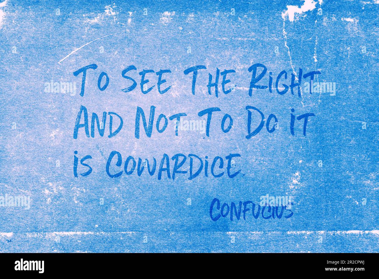 To see the right and not to do it is cowardice - ancient Chinese philosopher Confucius quote printed on grunge blue paper Stock Photo