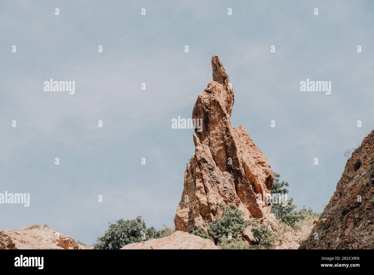 A close up of rocks that look like the beak of a bird or a sharp nose ...