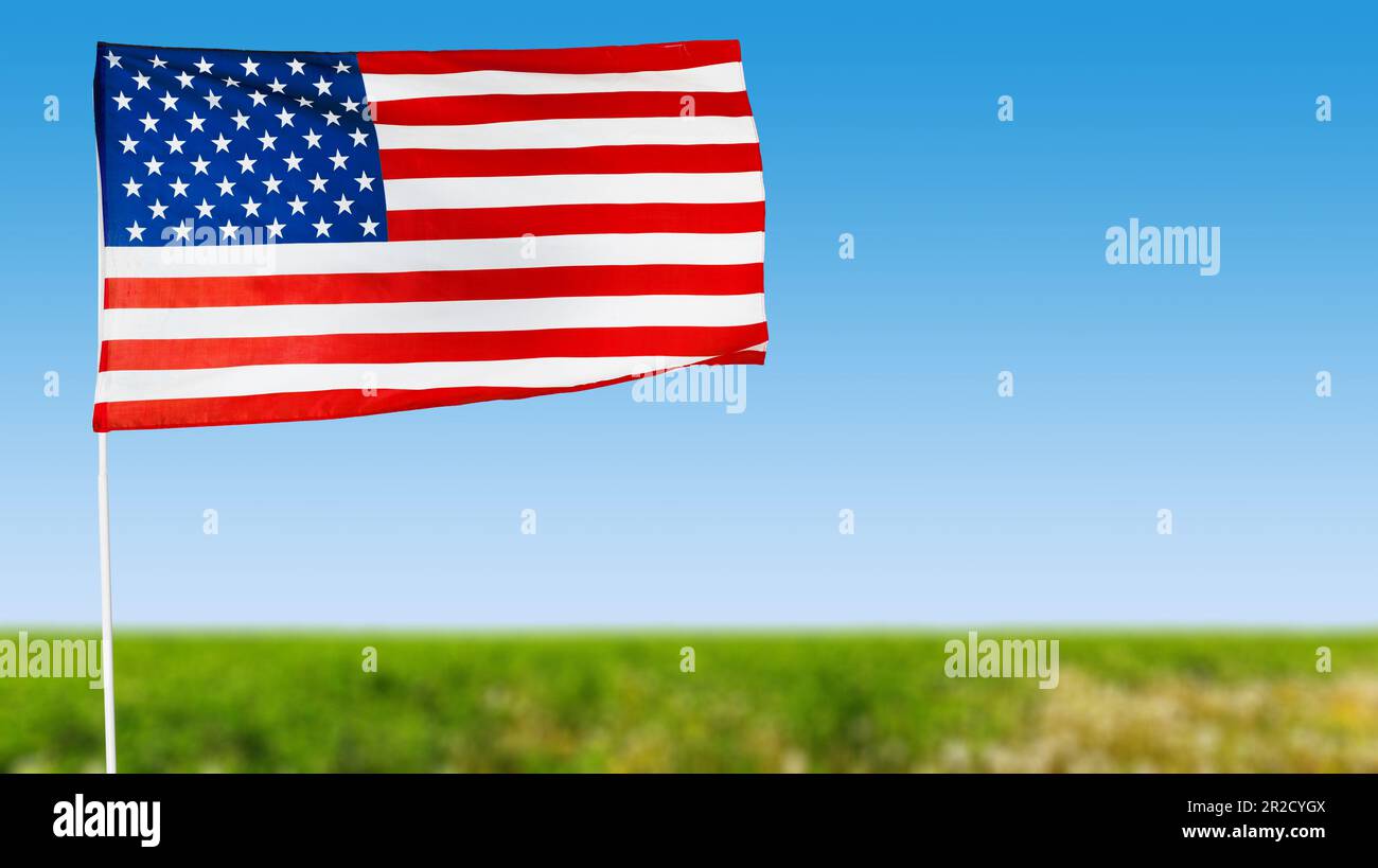American flag against blue sky Stock Photo - Alamy