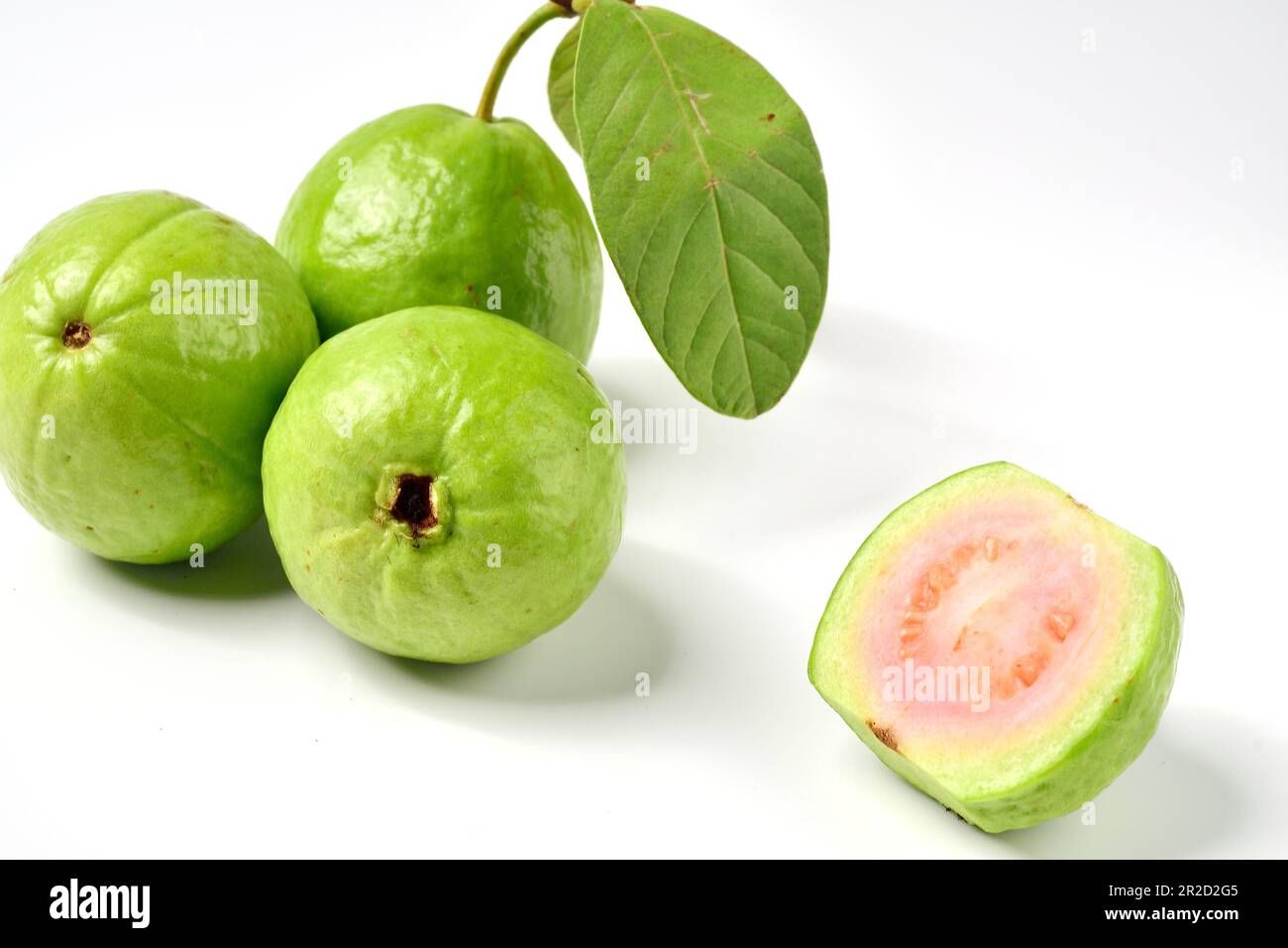 Pink guava fruits isolated on white background.Guava fruit with leaf