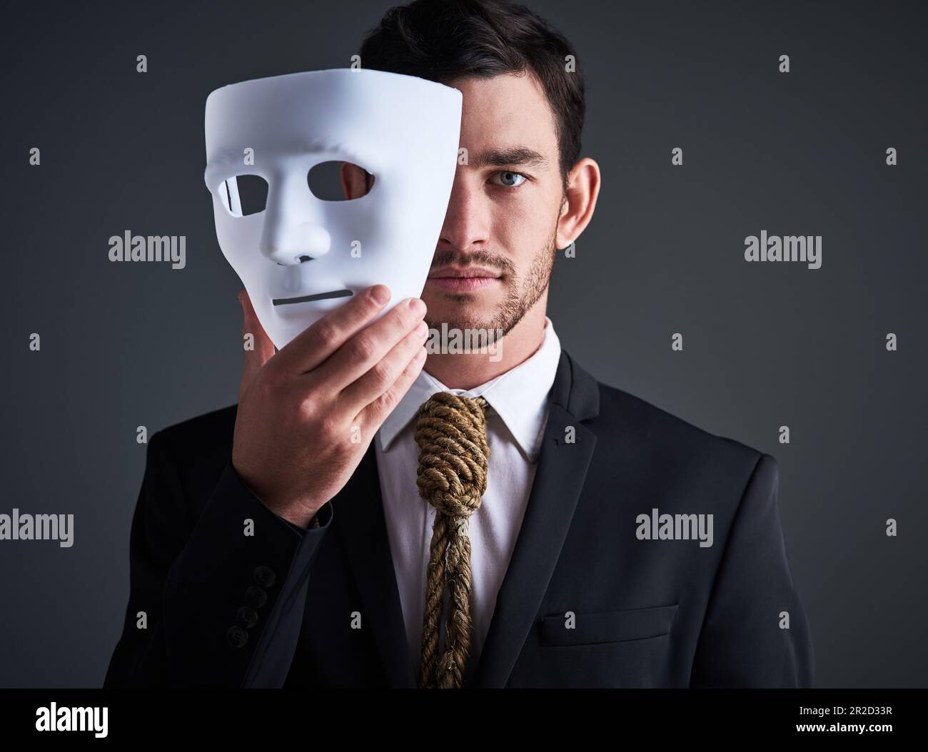 Two faced portrait, mask and fake businessman in a studio with serious