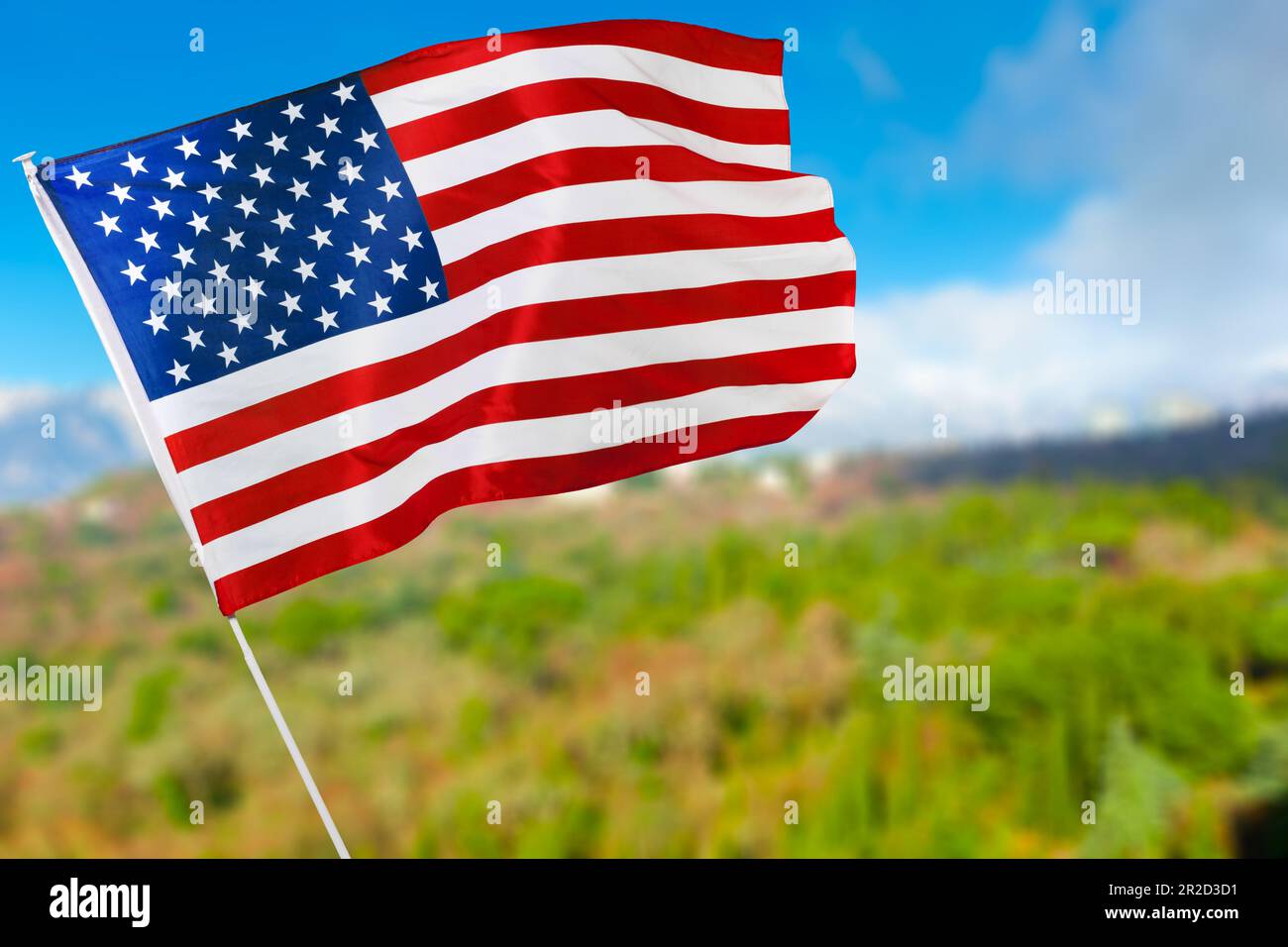 American flag against blue sky Stock Photo - Alamy