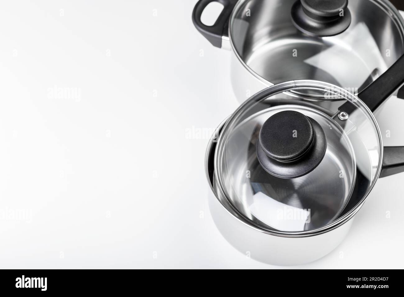 Stainless steel pots and pans isolated on white Stock Photo Alamy