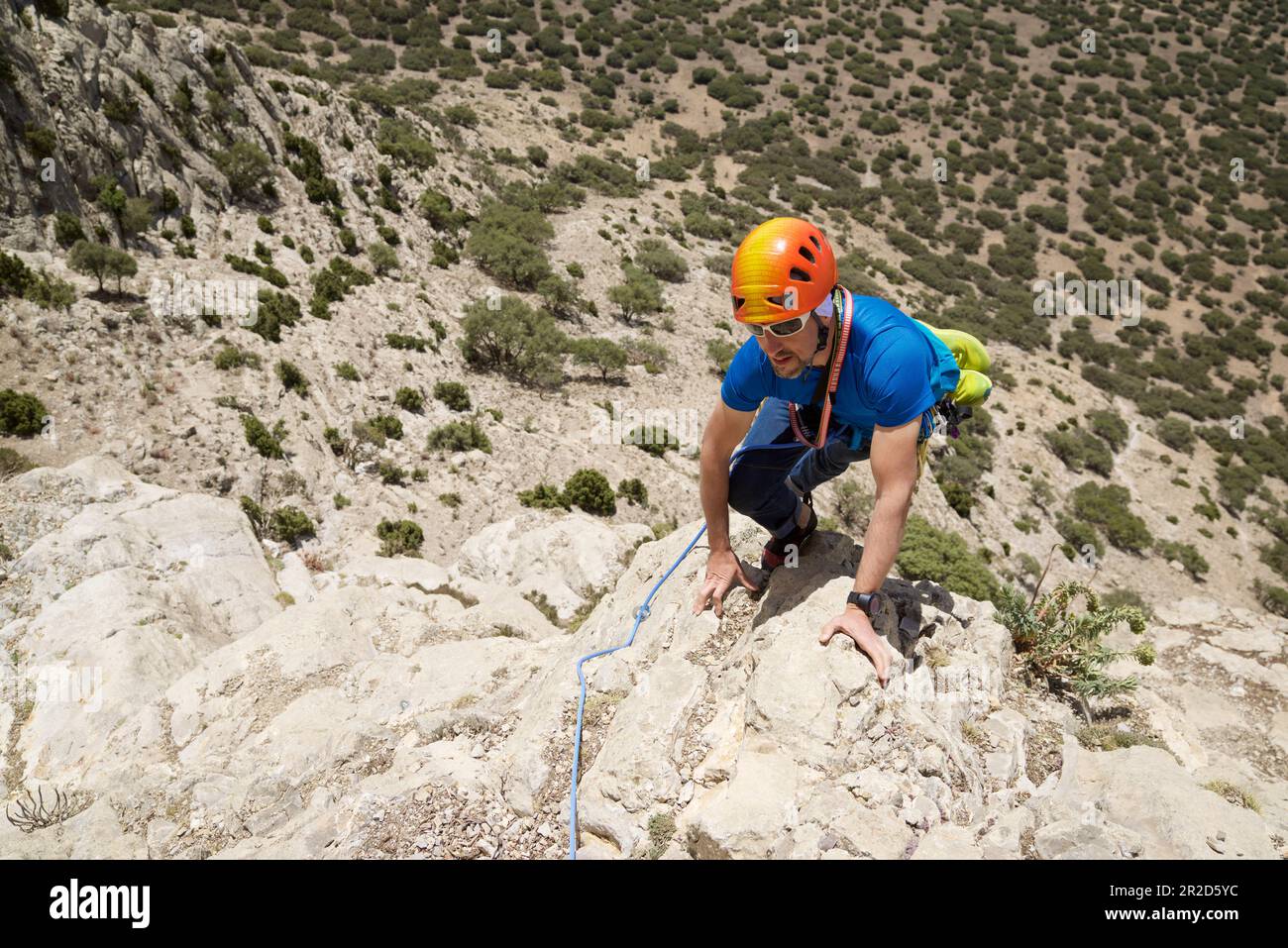 Climbing a free route in Palomera Peak in Spain Stock Photo