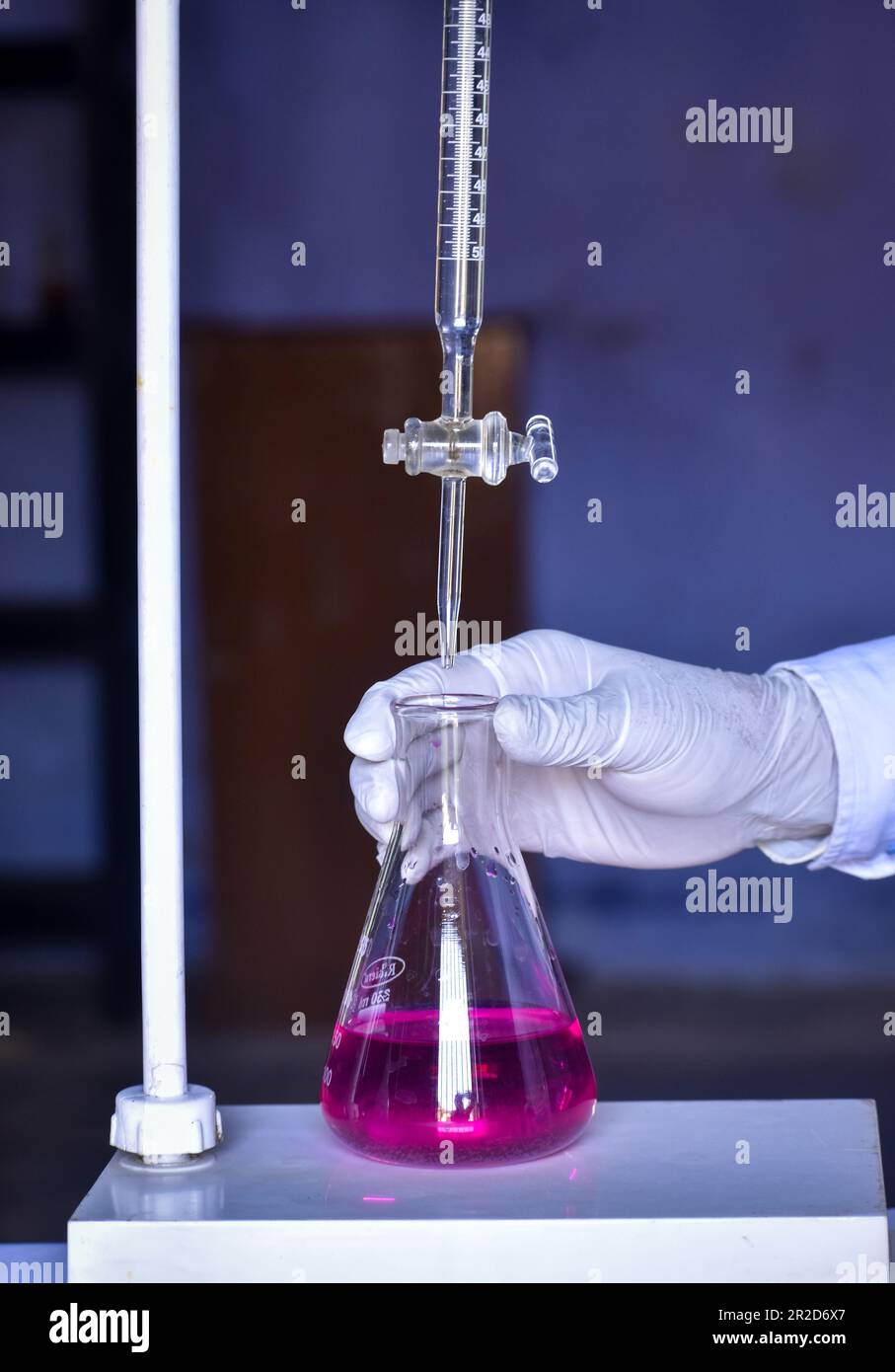 The scientist is conducting an acidbase titration in the lab