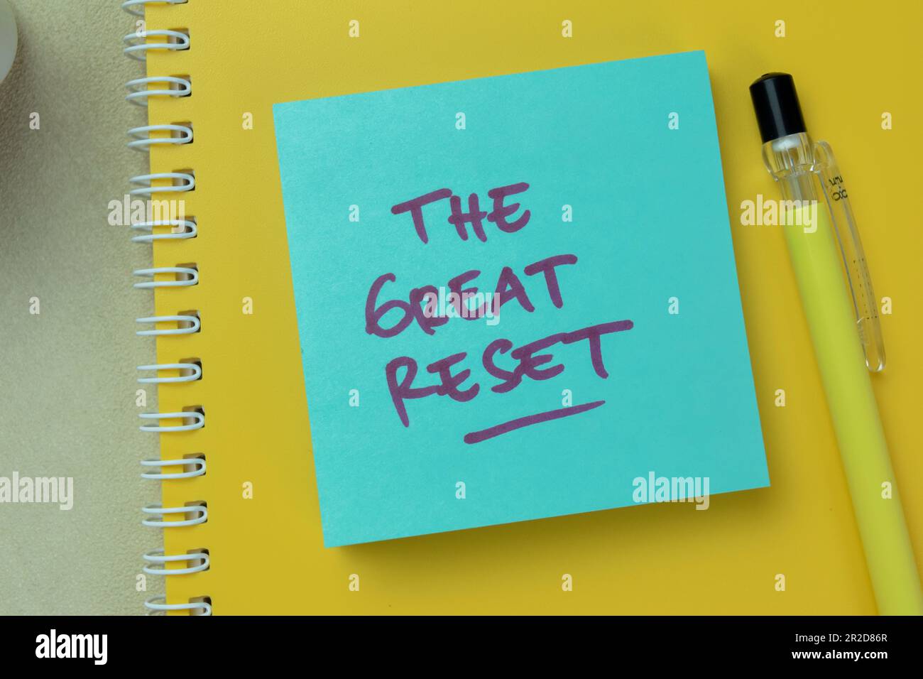 Concept of The Great Reset write on sticky notes isolated on Wooden Table. Stock Photo