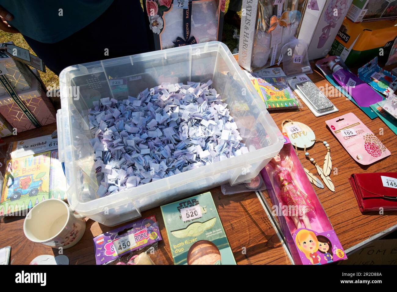 tombola stand at a local community summer fair simonswood england uk Stock Photo