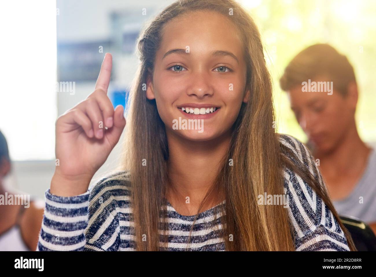Questions, hands up and portrait of girl in classroom for answer in ...