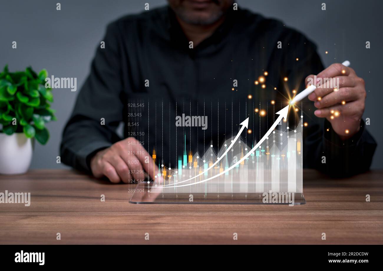 stock market Investments funds and digital assets. 2023 business finance technology and investment concept. businessman analyzing forex trading graph Stock Photo