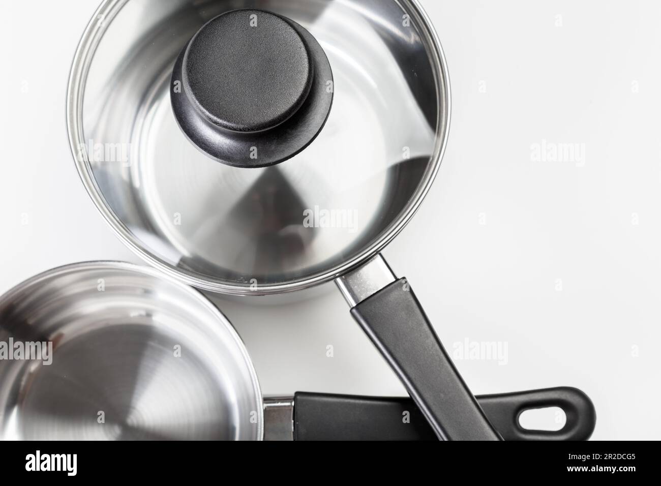 Stainless steel pots and pans isolated on white Stock Photo Alamy