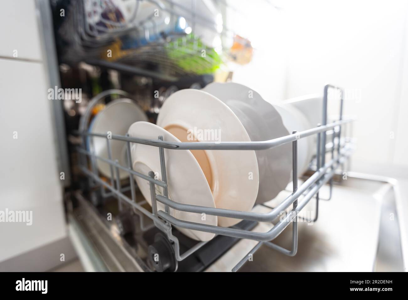 dishwasher closeup with washed dishes, easy to use and save water, eco