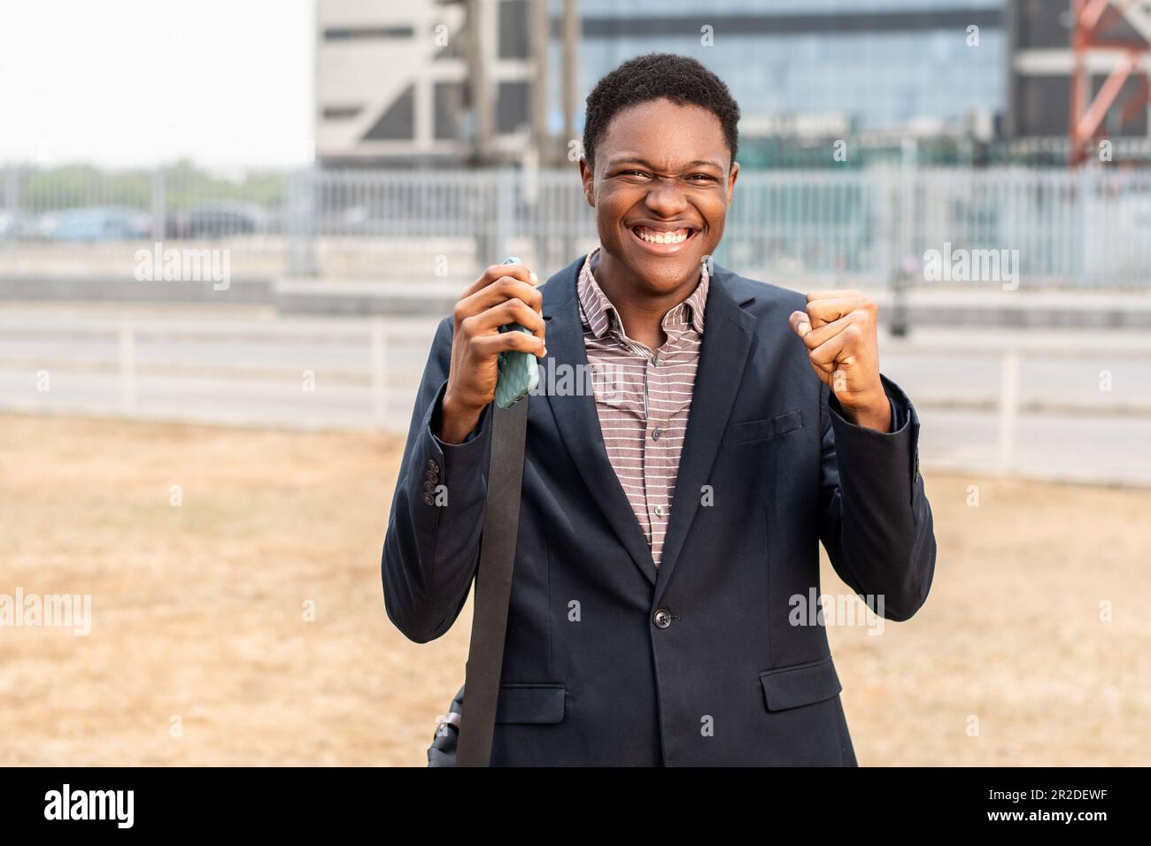 Cheerful african man wearing hi-res stock photography and images - Alamy