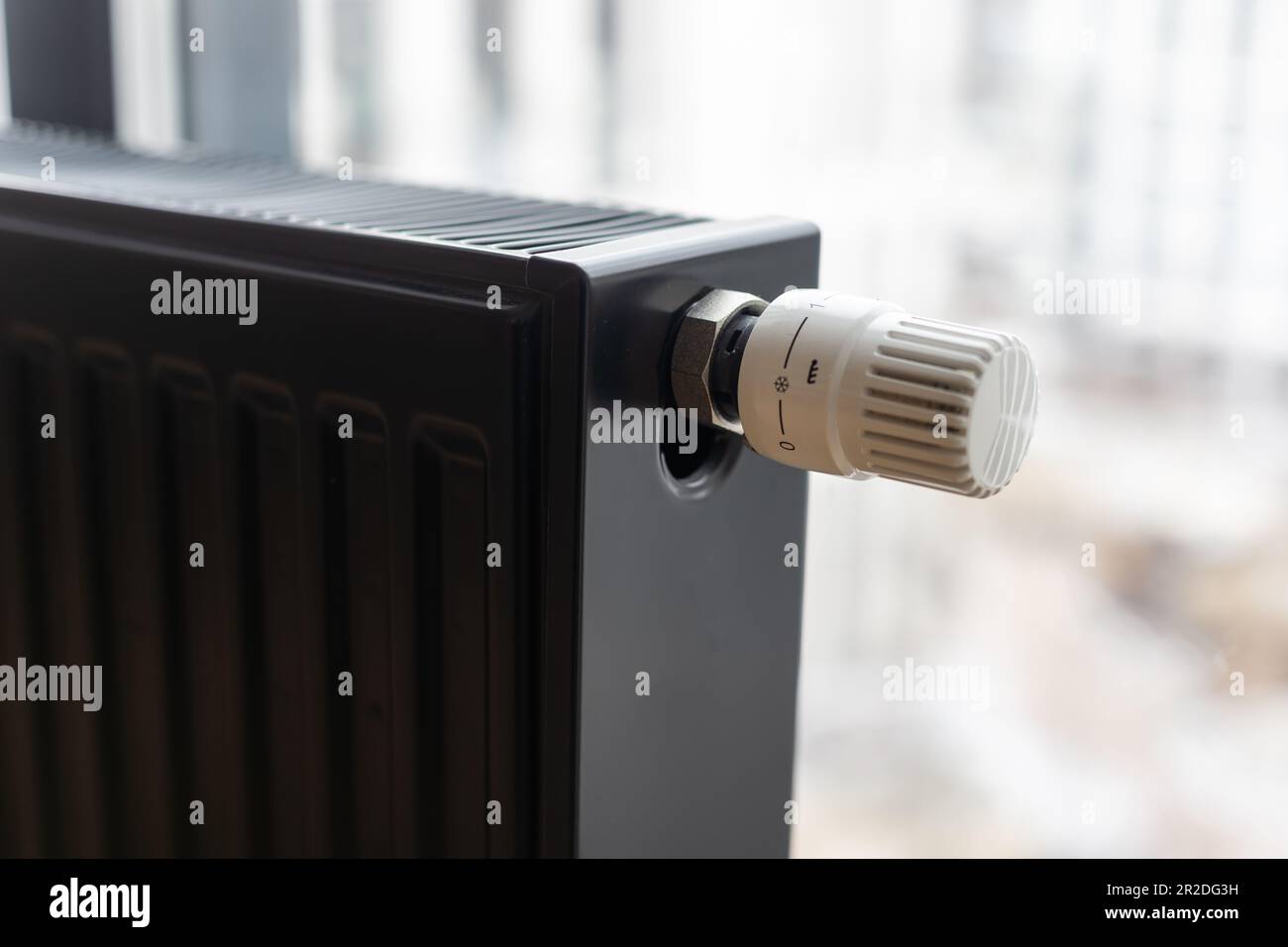 Heating radiator in room with laminated wooden floor Stock Photo Alamy