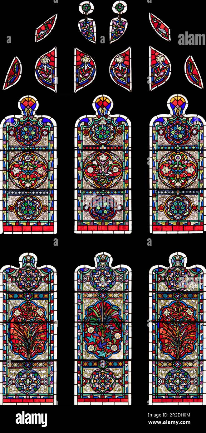 Colourful Victorian secular glass in St Peter and St Paul Church, Ormskirk, Lancashire, UK Stock Photo