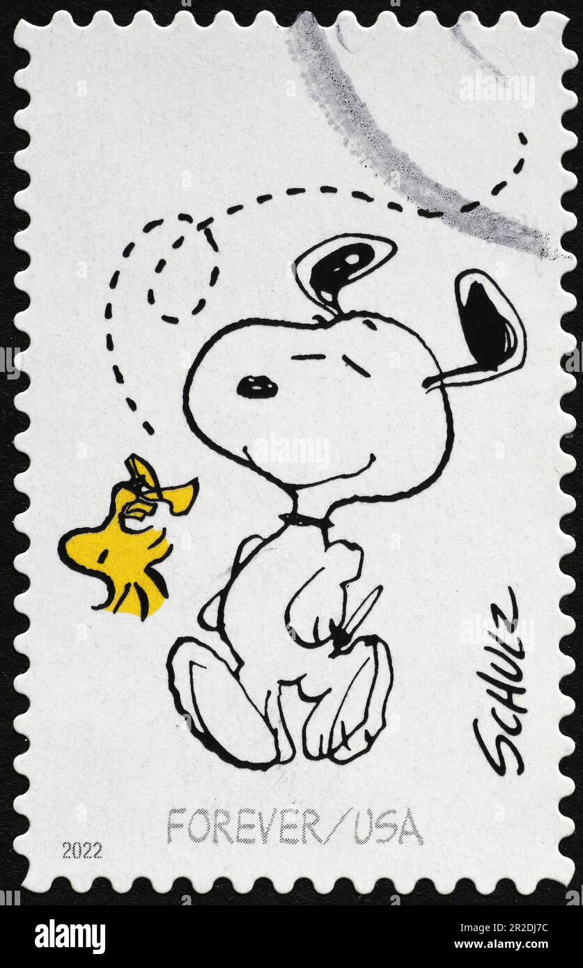 Snoopy and Woodstock, characters of Peanuts on postage stamp Stock