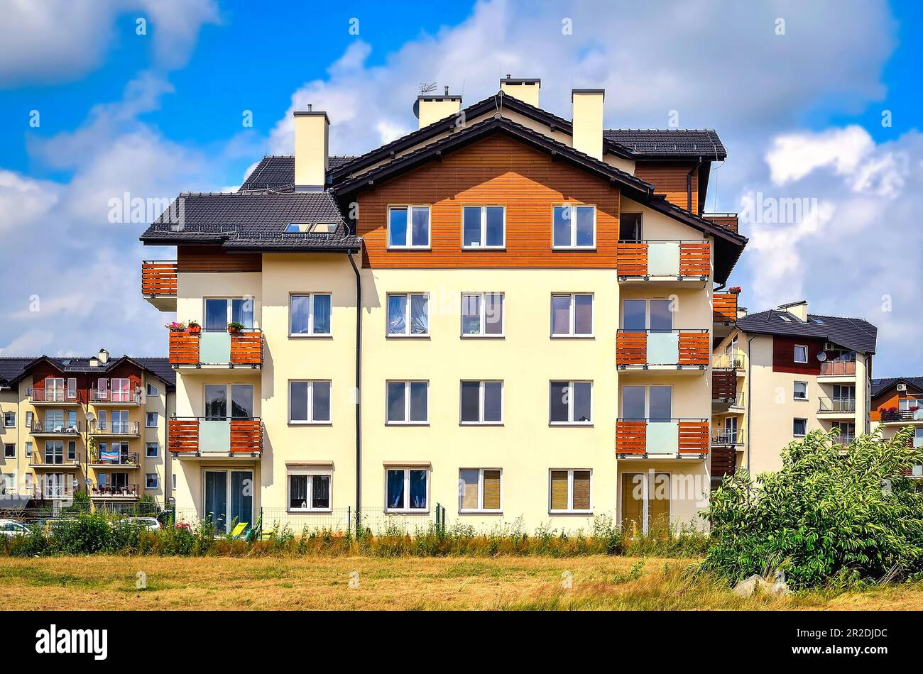Tychy, Poland - July 14, 2015: New housing estates in Tychy City, Poland. Public view of newly built block of flats in the green area. Stock Photo