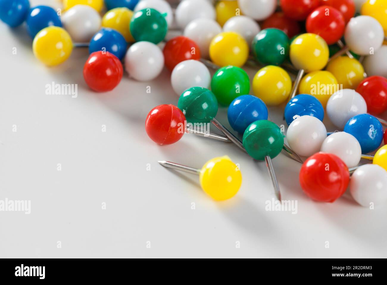 colorful color push pins isolated on white background Stock Photo - Alamy
