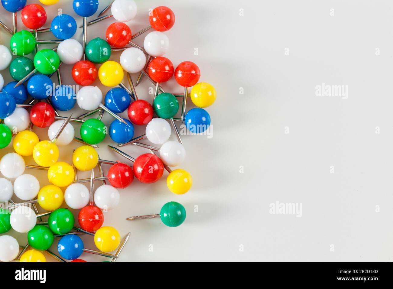 colorful color push pins isolated on white background Stock Photo - Alamy