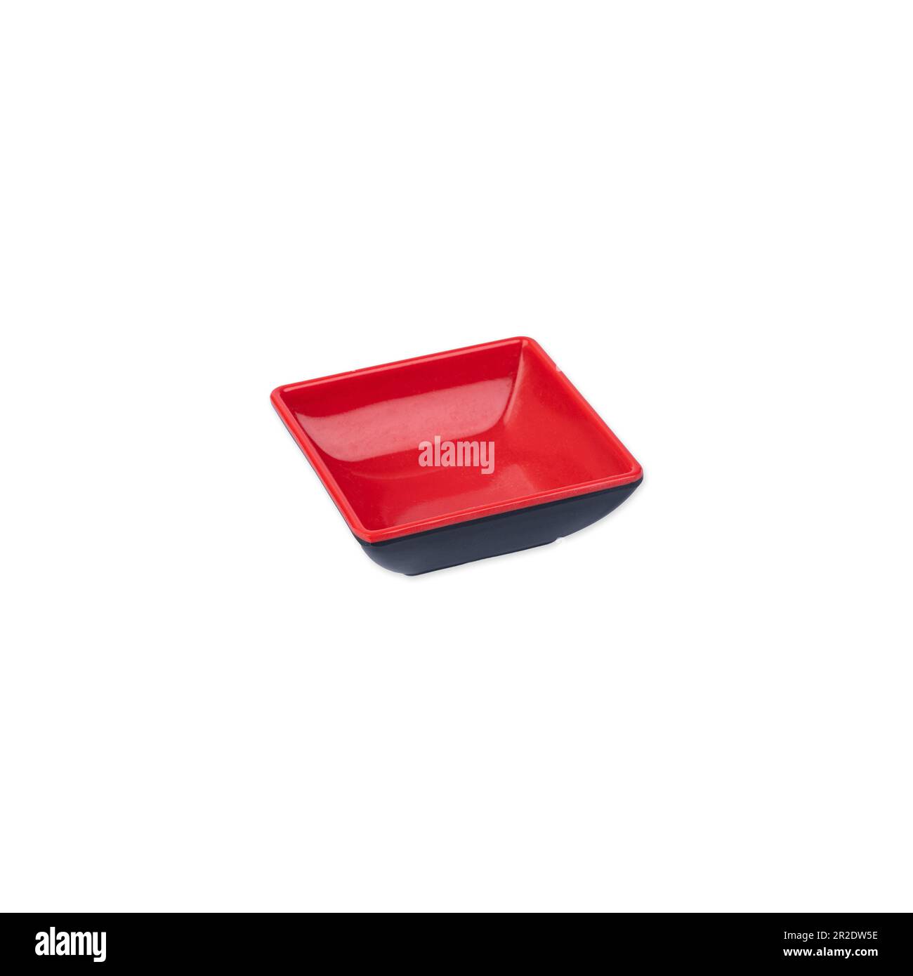 Small japanese style black and red plastic bowl isolated over white background. Stock Photo