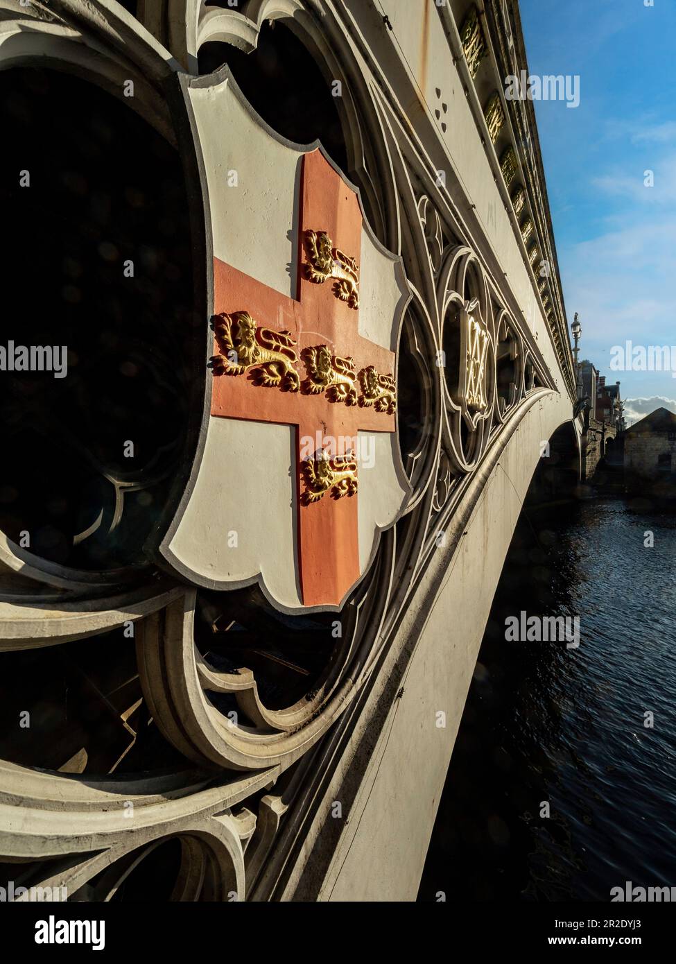 Closeup of the heraldic shields on the cast iron supports, and quarterfoiled railing of Lendal bridge in York. North Yorkshire. UK Stock Photo