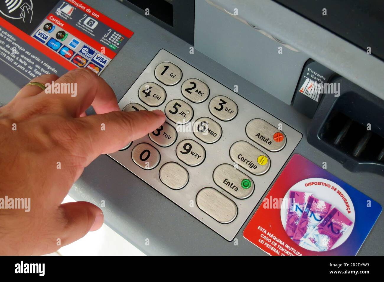 Minas Gerais, Brazil - February 24, 2023: detail on the use of an ATM at Bradesco bank Stock Photo