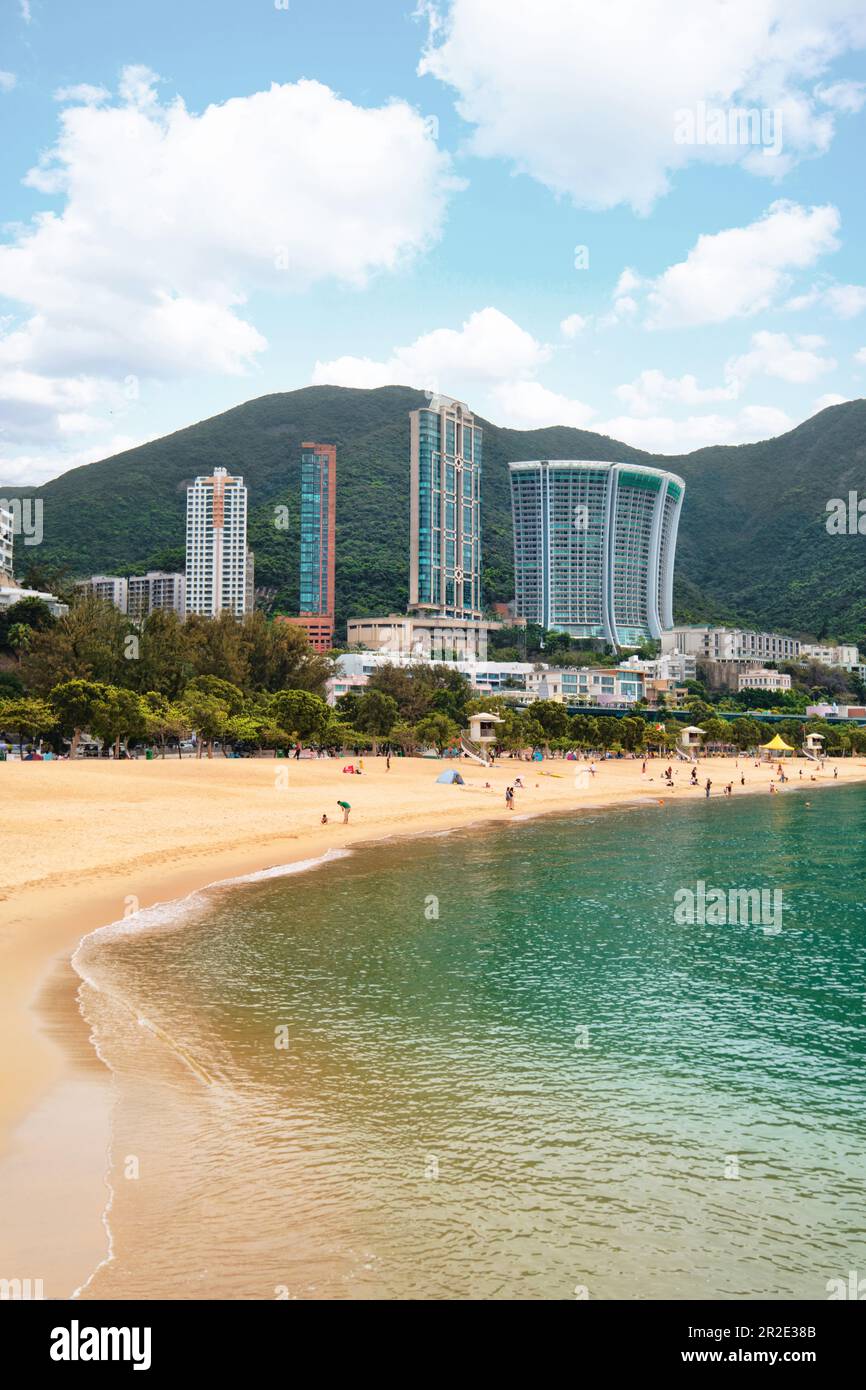 Hong Kong SAR, China - April 2023: High rise buildings skyscrapers and beach with golden sands at Repulse Bay Stock Photo