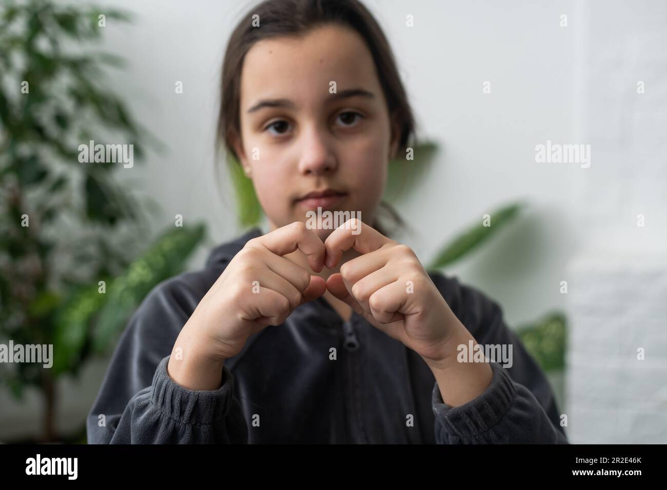 Beautiful smiling deaf girl using sign language Stock Photo Alamy