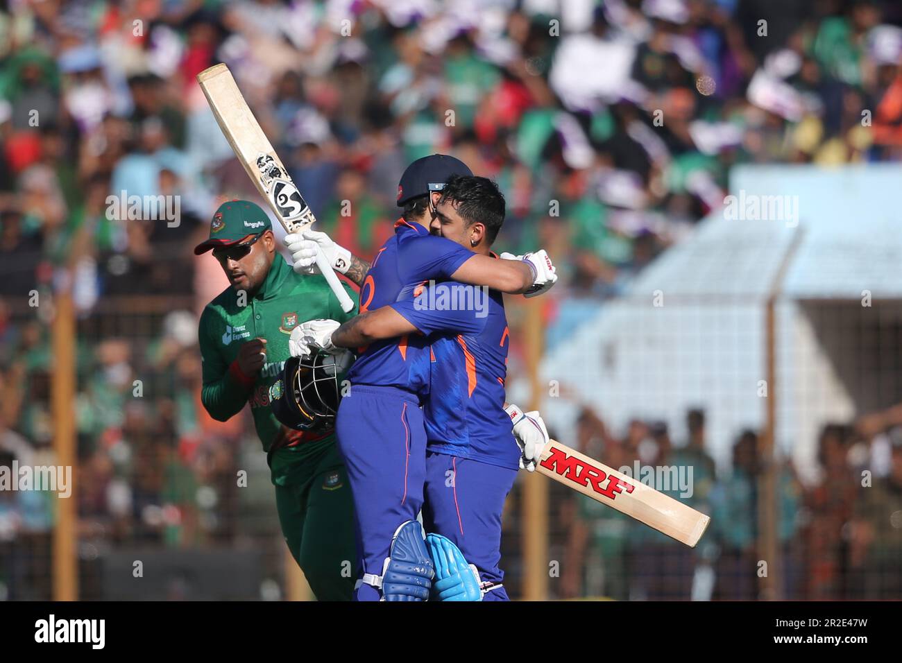 Viart Kohli (M) gives a hug to Ishan Kishan after his double hundred during the Bangladesh-India third One Day International (ODI) match at Zahur Ahme Stock Photo