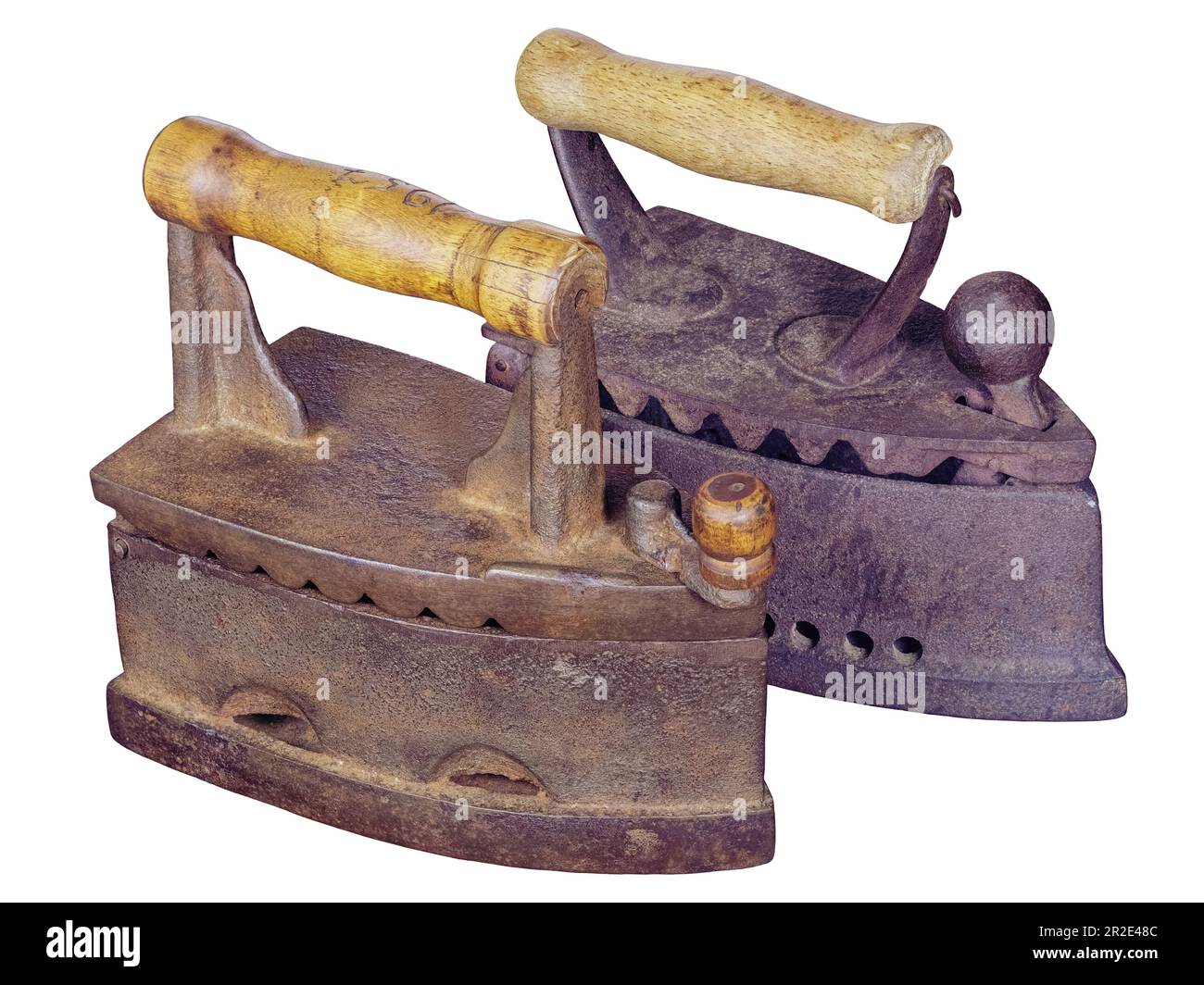 Two old rusty charcoal smoothing irons isolated on white background Stock Photo
