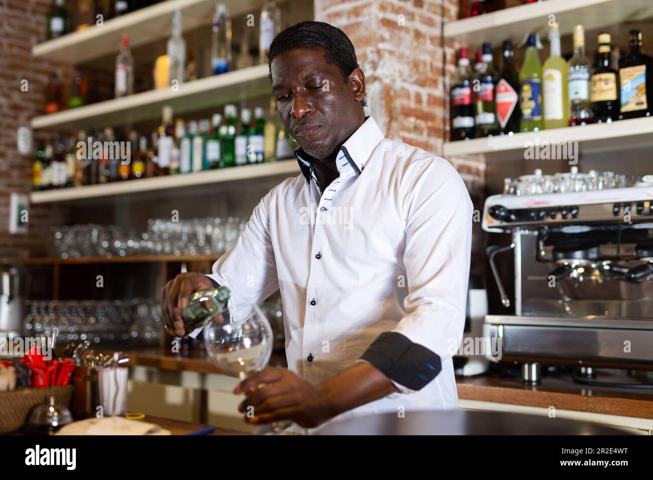 Bartender pouring a drink Stock Photo