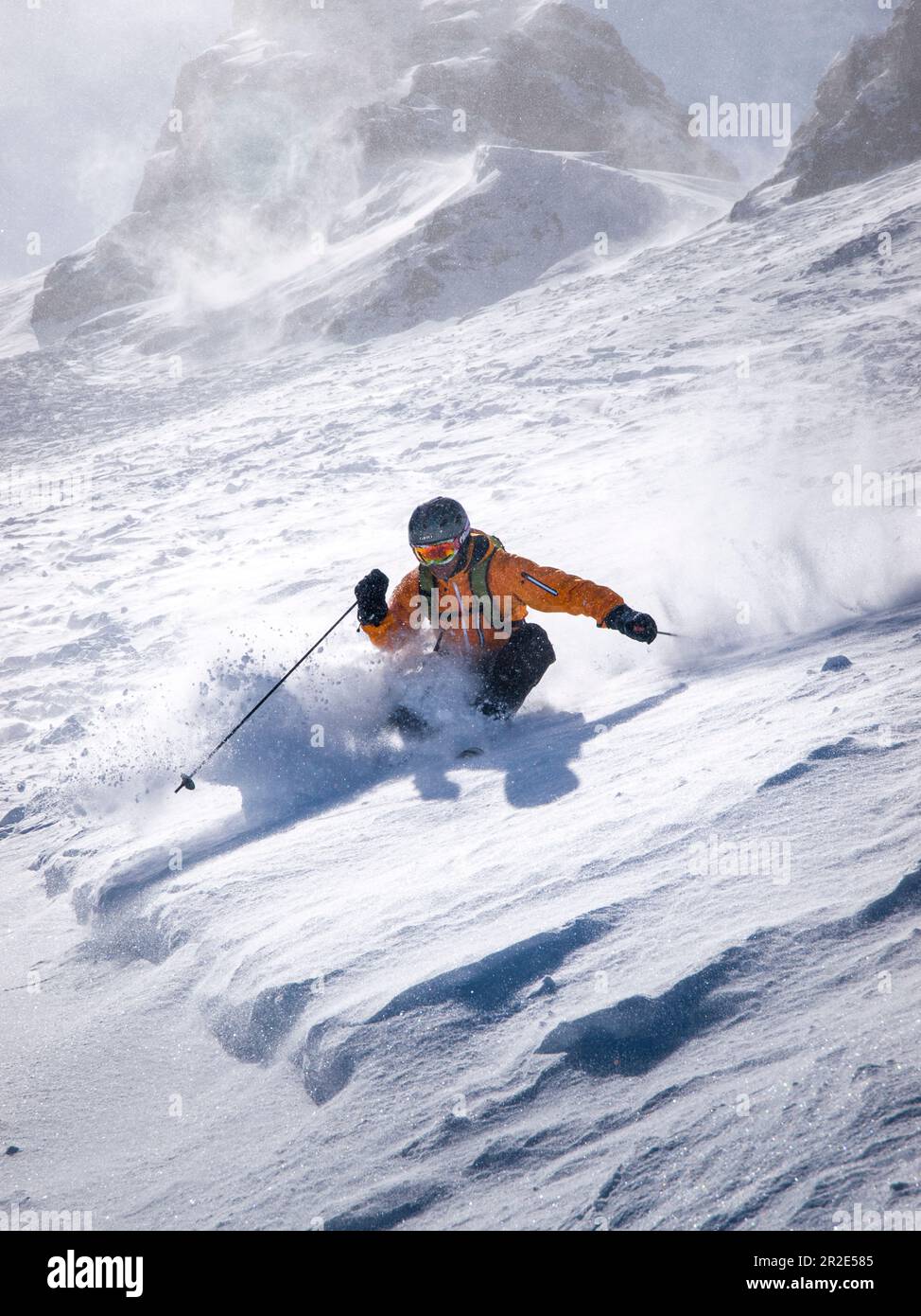 Off piste male skier on a windy day in the mountains above Engelberg, Switzerland Stock Photo