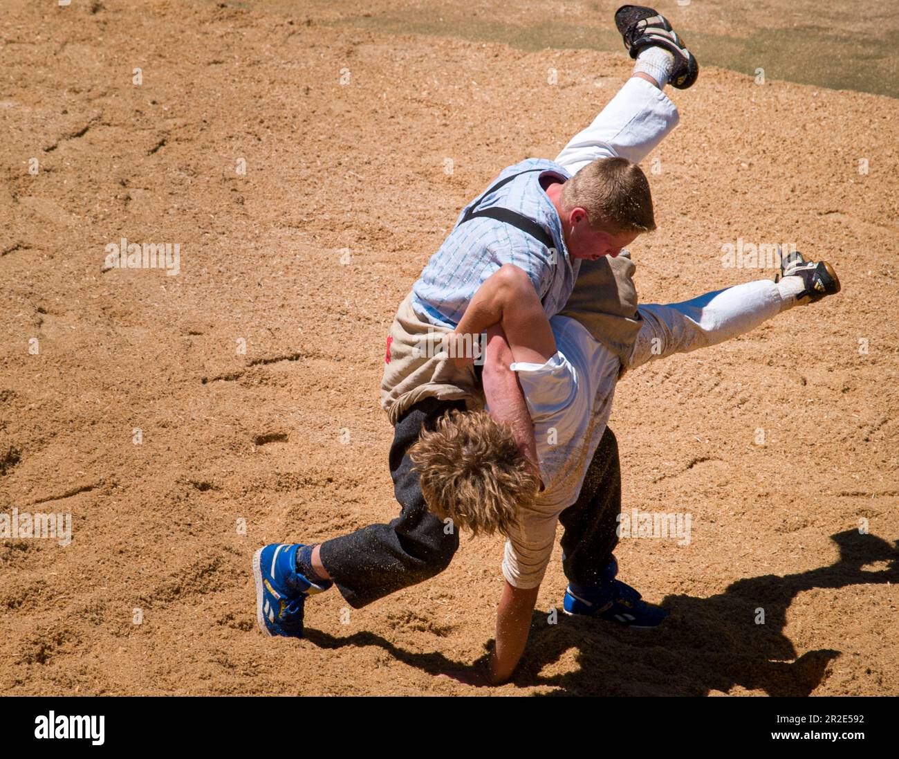 Alpine games, wrestling farmers at a Swiss summer event in a mountain
