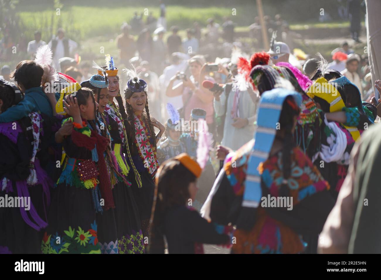 Bamburet, KPK,Pakistan - 05152023: Kalash men and women enjoying the Chilam Joshi Festival in Chitral Stock Photo